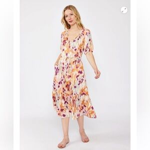A flowy bohemian midi dress in an abstract ikat print | by Lovestitch Clothing